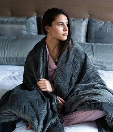 What are the benefits of using a weighted blanket?